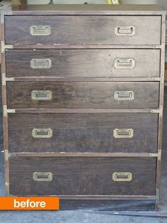 an old chest of drawers with brass handles