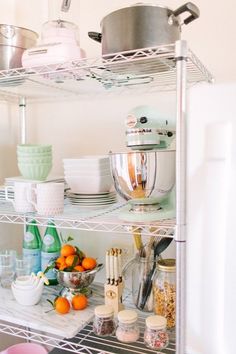 a kitchen shelf filled with lots of food