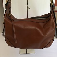 Nwot Fossil Hannah Zb7888200 Leather Hobo Shoulder Bag Brown. Inside: 1 Side Pocket, 1 Zip Pocket. Exterior: 1 Back Zipper Pocket. Adjustable Shoulder Strap. Old English Brass Hardware. 20.5” Shoulder Drop. Closure: Zipper 13.25” Long 8.5” High 5.32” Deep Shoulder Bag Brown, Hobo Shoulder Bag, Fossil Bags, Old English, Leather Hobo, Brass Hardware, Side Pocket, Brown Gold, Fossil