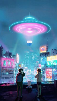 two people standing in front of a window looking out at the city and neon lights