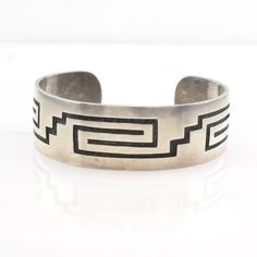 Circa  1970, "Born in 1944, Hopi jewelry artist Weaver Selina, began his career in 1967, working and studying at the Hopicrafts shop.  He studied jewelry making under Bernard Dawahoya and other experienced jewelers.  He is from the village of Shungopavi at Second Mesa. He and his wife, Alberta, who makes coiled baskets, own and operate Selina Hopi Silver Arts and Crafts, on Hwy 264 about a mile south of the Hopi Cultural Center." (hoelsindianshop.com) This bracelet will comfortably fit a 6 3/4" Artisan Bangle Bracelets For Collectors, Collectible Artisan Bracelet With Engraved Details, Artisan Engraved Bracelet For Collectors, Modernist Cuff Jewelry For Gift, Artisan Collectible Bracelet With Engraved Details, Artisan Engraved Bracelet Collectible, Modernist Handmade Cuff Bangle Bracelet, Modernist Bangle Jewelry As Gift, Modernist Bangle Jewelry Gift