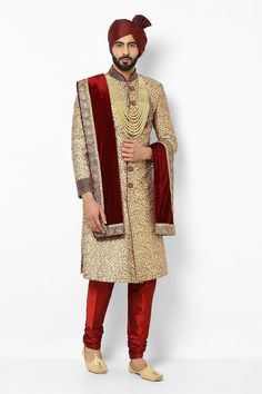 This item is made specially for you by hands with love  Item contains : Sherwani Pyjama Turban Stole  Mala & Shoes  Fabrics :   Brocade silk banaarsi  Colours :  Golden and maroon Style and Designs :  Sherwani has mandarin collar and long sleeves with a full button placket asymmetric hem and multiple slits  Embroidery with crystal beads hand embroidered motif on chest sleeves and sherwani and has embroidery work on collar and sleeves  Maroon solid churidar has a drawstring closure  Maroon turban Ceremonial Long Kurta With Dupatta, Gold Straight Kurta Sherwani With Dupatta, Gold Sherwani With Dupatta And Straight Kurta, Traditional Straight Kurta Sherwani With Pallu, Traditional Ceremonies Sherwani With Zari Work, Traditional Ceremonies Sherwani With Pallu, Festive Straight Kurta Sherwani For Traditional Ceremonies, Pallu Sherwani For Traditional Ceremonies, Sherwani With Pallu For Traditional Ceremonies