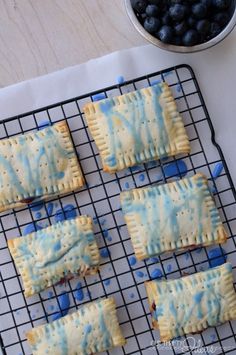 blueberries and crackers are on a cooling rack