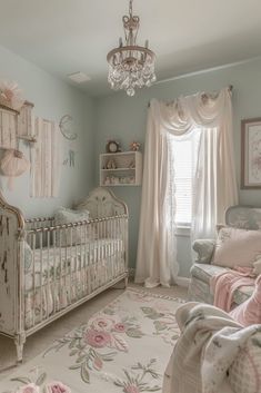 a baby's room with a chandelier and crib