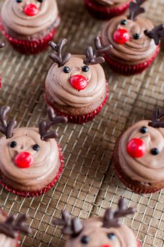 cupcakes decorated with chocolate frosting and reindeer noses