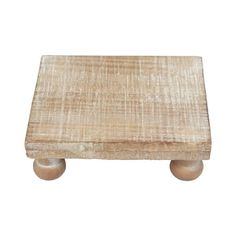 a small wooden table with two wheels on the bottom and one foot in the middle