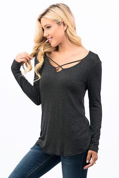 The criss cross long sleeve top has a relaxed fit, making it comfortable to wear all day long. - Crisscross - Long Sleeve - Solid Top - Color Charcoal - 95% Rayon - 5% Spandex Sizes: Small - 2-4 Medium - 6-8 Large - 10-12 Model is 5'8" and is wearing Small Rocker Chic Style, Cross Front Top, Rocker Chick, Criss Cross Top, Cross Top, Hipster Outfits, Rocker Chic, Edgy Outfits, Basic Tops