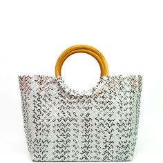 Treat the world as your personal runway with our one-of-a-kind, woven handbags made with sustainable rattan handles. Handmade from 100% upcycled materials and designed with 100% heart. *Every one of our bags are one-of-a-kind. This one you have selected (shown in first image) is 100% unique and is the exact one we'll send to you. Product Details Open top (no zipper) Soft and smooth to the touch, yet incredibly strong Double weave with 5-year warranty Handle made with sustainably sourced rattan R Trendy Beach Bag With Round Handle For Daily Use, Eco-friendly Top Handle Bucket Bag With Bamboo, Eco-friendly Bucket Bag With Bamboo Handle, Top Handle Beach Bag With Bamboo Handle For Shopping, Everyday Beach Bag With Bamboo Handle, Trendy Handwoven Straw Bag With Double Handles, Trendy Woven Straw Bag With Round Handle, Trendy Beach Bag Tote With Bamboo Handle, Everyday Straw Bag With Bamboo Handle