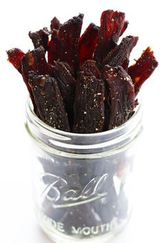 a jar filled with dried fruit sitting on top of a table