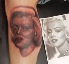 marilyn monroe portrait tattoo on the left arm and right leg, with an old photo in the background