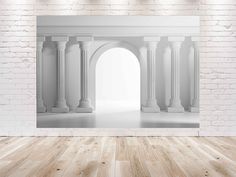 an empty room with white brick walls and columns