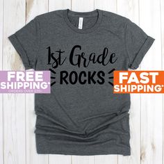 Field Trip Tee Shirts - 1st Grade Rocks T Shirt - Teacher Shirts - Cute Teacher Shirts - Funny Teacher Shirts Shirts 》》》》FAVORITE OUR SHOP TO GET AMAZING DEALS EVERY WEEK!《《《《 Click Below https://www.etsy.com/shop/GreyisthenewblackCo + Poly/Cotton Blend + Exclusive T-shirt branded unisex tee designed and printed in the USA. + Professionally printed super soft funny and awesome tees. + Our lightweight fitted tees are made from ultra soft ringspun cotton to get that comfortable fit and feel. + Sat Funny Teacher Shirts, Teacher Tee Shirts, Kindergarten Teacher Gifts, Nana T Shirts, Kindergarten Teacher Shirts, Christmas Tee Shirts, Group Shirts, Funny Tee Shirts, Grandma Shirts