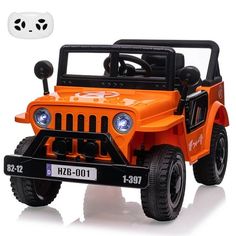 an orange toy jeep with lights on