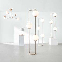 an assortment of modern lamps in a white room