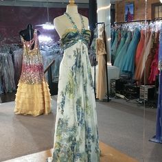 Halter Top Style With Sequin Straps And Under Chest, Blue And Yellow Flower Patterns, And Ruffled Yellow And Blue Top With Mostly Open Back Earthy Prom Dress, Peacock Dresses, Halter Top Prom Dresses, Fae Dress, Black Sequin Prom Dress, Prom Proposals, High Low Party Dresses, Black Lace Dress Long, Blue And Yellow Dress