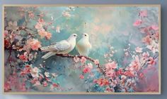 two white birds sitting on a branch with pink flowers