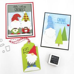 two christmas cards, one with gnomes and the other has a rubber stamp on it