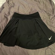 Nike Golf Skirt. Dri Fit Fitted Black Tennis Bottoms, Black Sports Skort With Pockets, Black Tennis Skirt With Pockets For Sports, Casual Black Tennis Skirt, Sporty Black Tennis Skort, Sporty Black Skort For Tennis, Black Sporty Pleated Mini Skirt, Sporty Black Pleated Mini Skirt, Black Mini Skirt For Sports, Spring Season