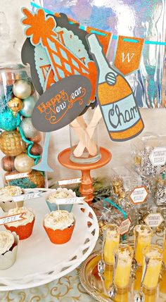 a table topped with desserts and drinks