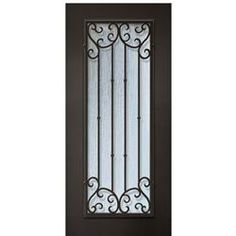 an iron door with glass panels and wrought designs on the side panel, in dark brown