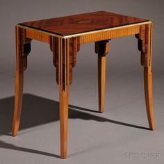 a small wooden table with two legs and a glass top on the bottom, against a gray background