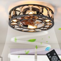 a ceiling light with remote controls in front of it