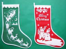 two christmas stockings with santa claus and snowmen on them, one is green and the other is red