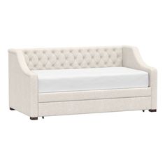 a white daybed with a mattress on it's back and footrests