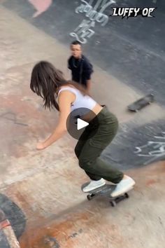 a person riding a skateboard on top of a cement ramp with graffiti written on it