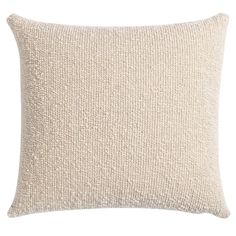 a white pillow with a textured design on the front and back, sitting on a white background