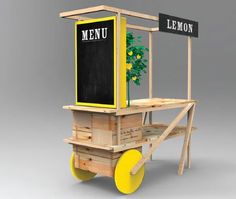 a small cart with lemons on wheels and a menu board attached to the back