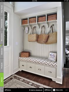 a white bench with baskets on it in a room