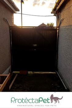 an open gate in the back yard of a house