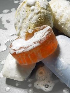 there are three different types of ice creams on the white plate and one is orange