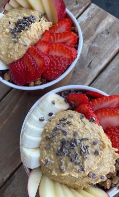 two bowls filled with different types of fruit on top of a wooden table next to each other