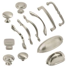 an assortment of knobs and handles on a white background