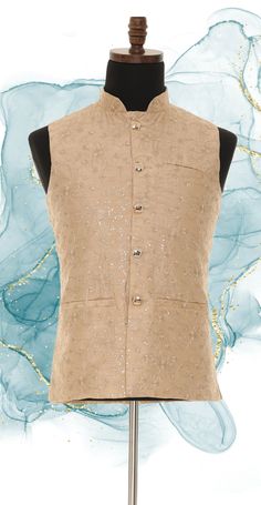 This Readymade Beige Sleeveless attire Harvest with thread work, this Nehru jacket made of art silk fabric and embroidery with same color thread and Enhanced with sequences, Buttons, and Crafted in a mandarin Collar Neck. Specifications Sleeve Length - Sleeveless Lined with Polyester and rayon lining Top Shape - Straight Top Hemline - Straight Neck - Mandarin Collar Jacket Pattern - Floral Size 36 to 50 Available WASH CARE INSTRUCTIONS - Please dry clean only when it is applicable. Slight color variation is possible due to digital photography. Indian Traditional Wear, Mandarin Collar Jacket, Indian Party, Indian Party Wear, Nehru Jacket, Nehru Jackets, Collar Neck, Collar Jacket, Indian Traditional