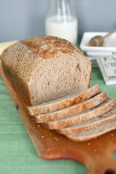 a loaf of sourdough whole wheat bread on a cutting board with the words baking sense