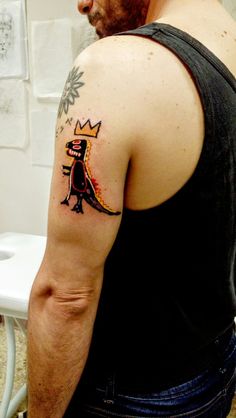 a man with a tattoo on his arm