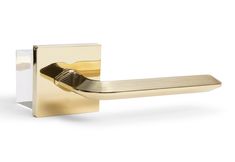 a gold door handle on a white background