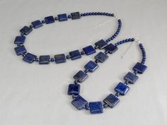 "This will be your new go-to necklace! Beautiful square pillow-shaped lapis lazuli beads really show off the vibrant blue color with gold pyrite flecks and are set apart by shiny little sterling silver and round lapis lazuli beads. Wear it with your daily denim, office attire, and Sunday best. Blue lapis is a fashion faithful gemstone. Check out these matching pieces which are sold separately: https://www.etsy.com/listing/556798587 https://www.etsy.com/listing/556788745 https://www.etsy.com/list Rectangular Lapis Lazuli Jewelry As Gift, Blue Beaded Rectangular Jewelry, Blue Rectangular Beaded Jewelry, Blue Lapis Lazuli Rectangular Jewelry, Rectangular Blue Necklace With Natural Stones, Blue Rectangular Natural Stone Necklace, Lapis Necklace, Lapis Lazuli Jewelry, Bling Necklace