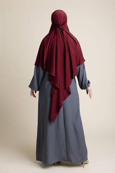 Searching for a traditional-yet-elegant khimar? The Classic Khimar - Habibah is your ideal pick. Crafted from superior Nida material and featured in a regal maroon hue, it offers long-lasting comfort and coverage. Perfect for formal events to everyday modest coverage, the Habibah Khimar is an essential addition to any hijabi wardrobe. Plus, it's perfect for your daily prayers or for Muslim women going for Hajj and Umrah. Hijabi Wardrobe, Hijab Colors, Jersey Hijab, Bamboo Shades, Daily Prayers, Adjustable Headband, Daily Prayer, Muslim Women, Relaxed Style