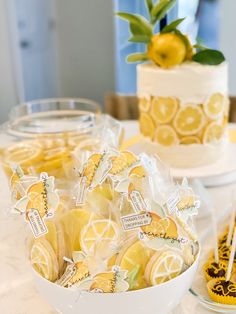 a table topped with lemon slices and cakes