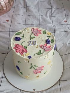 a decorated cake sitting on top of a white plate