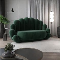 a green couch sitting on top of a white rug