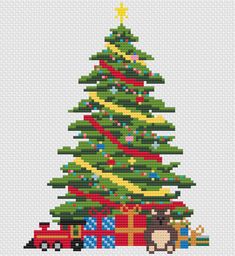 a cross stitch christmas tree with presents on the bottom and an animal under it in front