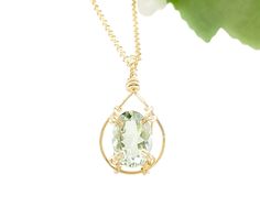 A beautiful, clear oval green amethyst is wire-wrapped to a handcrafted teardrop-shaped pendant frame. So classy and elegant! MATERIAL Gold filled chain Gold filled wire Genuine oval-shaped green amethyst gemstone SIZE 14x10mm gemstone 17.5 inch chain CLOSURE Lobster clasp WHAT IS GOLD FILLED? We used to have just 2 choices: pure gold or gold plate. The first was very expensive and the second was...well...not very good. Our gold filled jewelry is designed to last you a lifetime without the price Elegant Oval Wire Wrapped Necklace, Oval Green Amethyst Jewelry With Gemstone Accents, Green Amethyst Pendant Necklace As Gift, Green Amethyst Oval Jewelry, Green Oval Amethyst Jewelry, Oval Green Amethyst Jewelry, Faceted Oval Necklace For Weddings, Oval Faceted Necklace For Wedding, Green Amethyst Jewelry For May Birthstone Gift