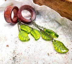 "1 PAIR of handmade Organic Glass Tree Leaf Dangles AVAILABLE AS- Plug Gauges (Solid no hole) or Tunnels (Hole in the middle) SIZE OPTIONS: 2G (6mm) 1G (7mm) OG (8mm) 3/8\" (9mm) 00G (10mm) 7/16\" (11mm) 1/2\" (12mm) 1/2\" (13mm) 9/16\" (14mm) 19/32\" (15mm) 5/8\" (16mm) 43/64\" (17mm) 11/16' (17.5mm) 3/4\" (19mm) 13\"/16\" (20mm) 7/8\" (22mm) 15/16\" (24mm) 1\" (25.5mm) 1 & 1/8\" (28mm) 1 & 5/32\" (29mm) 1 & 1/4\" (32mm) 1 & 3/8\" (35mm) 1& 7/16\" (36mm) 1 & 1/2\" (38mm) Wedding Gauges, Glass Ear Plugs, Dangle Gauges, Wood Resin Necklace, Dangle Plugs, Wooden Plugs, Ear Accessories, Organic Glass, Wood Plugs