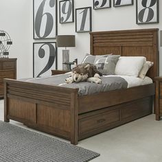 a dog laying on top of a bed in a bedroom