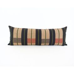 a black and tan striped pillow on a white background